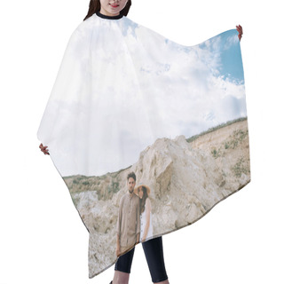 Personality  Couple Holding Hands And Standing In Sand Canyon With Cludy Sky Hair Cutting Cape
