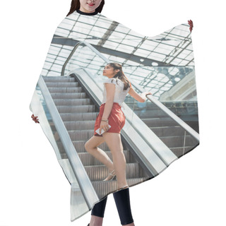Personality  Young Asian Woman Holding Smartphone While Looking Away On Escalator Hair Cutting Cape