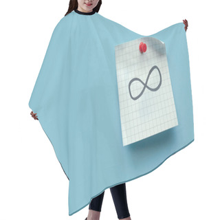 Personality  Infinity Sign Or Symbol Handwritten On A Memo Note Over Blue Background. Hair Cutting Cape