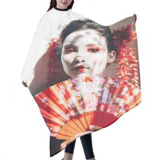 Personality  Portrait Of Beautiful Geisha With Red And White Makeup Holding Hand Fan In Sunlight Hair Cutting Cape
