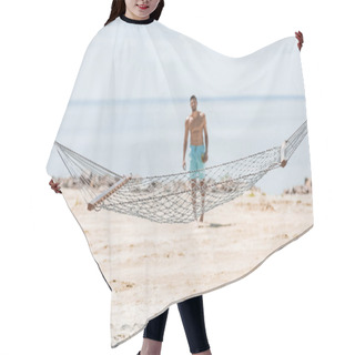 Personality  Selective Focus Of Hammock And Shirtless Man Walking On Beach On Background Hair Cutting Cape