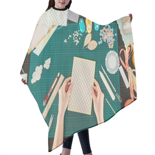 Personality  Cropped Image Of Designer Holding Template For Scrapbooking Postcard Hair Cutting Cape