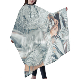 Personality  Top View Of Stylish Woman Posing In Silver Bodysuit And Raincoat On Metallic Background Hair Cutting Cape