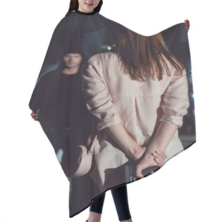Personality  Back View Of Woman Hiding Gun Behind Back Near Thief At Night Hair Cutting Cape