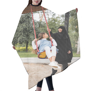 Personality  Smiling Muslim Mother Standing Near Daughter On Swing Outdoors  Hair Cutting Cape