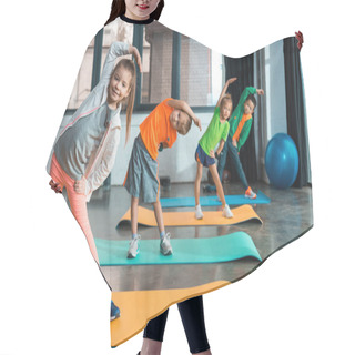 Personality  Selective Focus Of Multicultural Children Warming Up On Fitness Mats In Gym Hair Cutting Cape
