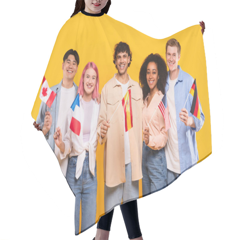 Personality  International Friendship. Happy Multiracial People Holding Different Countries Flags And Smiling At Camera, Standing On Yellow Studio Background. Modern Education Of Students Or Immigrants Hair Cutting Cape