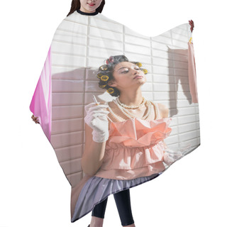 Personality  Asian Young Woman With Hair Curlers Standing In Pink Ruffled Top, Pearl Necklace And Gloves Smoking And Holding Glass Near Wet Laundry Hanging Near White Tiles, Cigarette, Housewife  Hair Cutting Cape