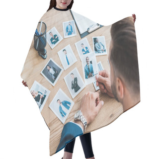 Personality  Selective Focus Of Recruiter Holding Photo Of African American Man On Wooden Table  Hair Cutting Cape