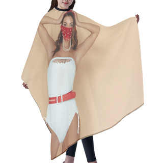 Personality  Stylish Girl In Bathing Suit And Mask Touching Hair And Standing On Beige  Hair Cutting Cape