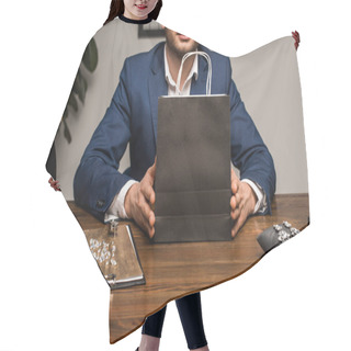 Personality  Cropped View Of Jewelry Appraiser Holding Paper Bag Near Jewelry On Table In Workshop Hair Cutting Cape