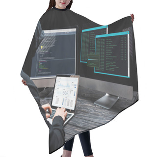 Personality  Hacker Using Laptop With Charts And Graphs On Screen Near Computer Monitors On Black  Hair Cutting Cape