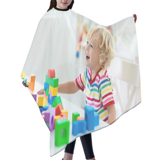 Personality  Kid Playing With Colorful Toy Blocks. Little Boy Building Tower Of Block Toys. Educational And Creative Toys And Games For Young Children. Baby In White Bedroom With Rainbow Bricks. Child At Home. Hair Cutting Cape