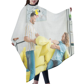 Personality  Side View Of Happy Homosexual Men Pillow Fighting In Living Room  Hair Cutting Cape