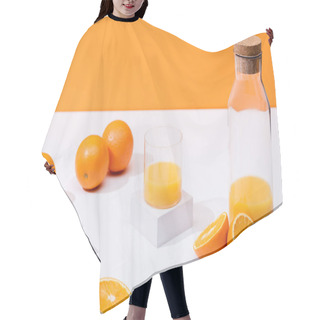 Personality  Fresh Orange Juice In Glass And Bottle Near Ripe Oranges On White Surface Isolated On Orange Hair Cutting Cape