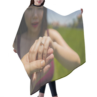 Personality  Romantic Marriage Proposal . Close Up Hands Of Happy Asian Couple In Love Holding Together , The Woman With Engagement Ring On Her Finger Isolated On Green Field Hair Cutting Cape