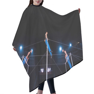 Personality  Low Angle View Of Gymnasts Performing On Horizontal Bars In Circus   Hair Cutting Cape