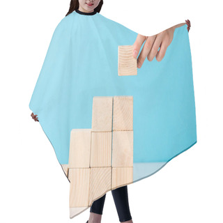 Personality  Cropped View Of Businessman Putting Wooden Cube On Blue  Hair Cutting Cape