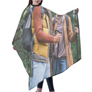 Personality  Cropped View Of Woman Holding Hiking Sticks And Walking With Boyfriend In Forest  Hair Cutting Cape