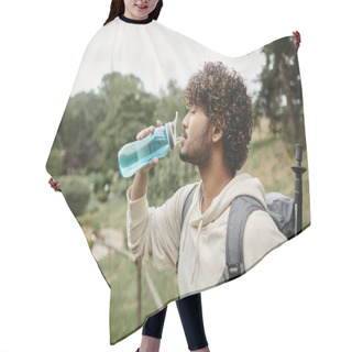 Personality  Side View Of Indian Traveler With Backpack Drinking Water With Landscape On Background Hair Cutting Cape