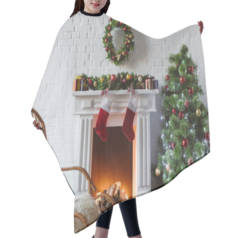 Personality  living room with fireplace, rocking chair and decorated christmas tree hair cutting cape