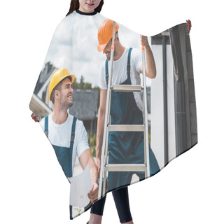 Personality  Happy Builder Looking At Coworker In Helmet Standing On Ladder  Hair Cutting Cape
