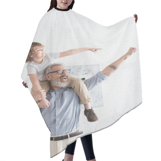 Personality  Excited Boy And Grandfather Gesturing At Home  Hair Cutting Cape