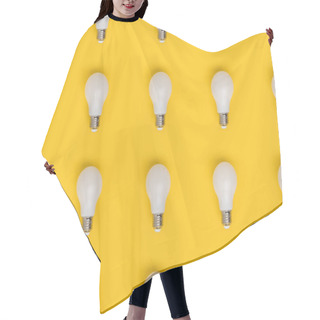 Personality  Full Frame Of Arrangement Of Light Bulbs Isolated On Yellow Hair Cutting Cape
