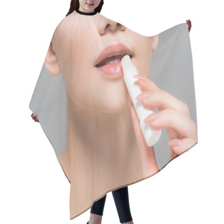 Personality  Cropped View Of Young Woman Holding Lip Balm Near Lips Isolated On Grey  Hair Cutting Cape