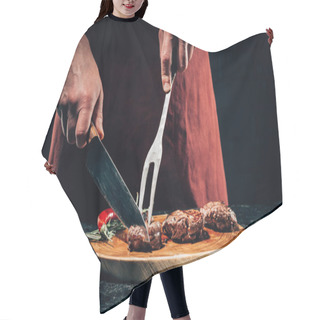 Personality  Cropped Shot Of Chef In Apron With Meat Fork And Knife Slicing Gourmet Grilled Steaks With Rosemary And Chili Pepper On Wooden Board  Hair Cutting Cape