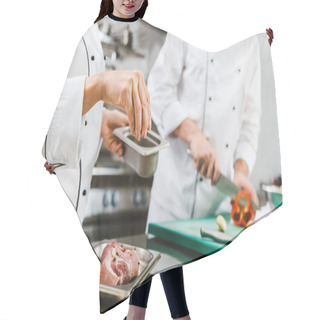 Personality  Cropped View Of Female Chef Seasoning Meat While Man Cooking On Background In Restaurant Kitchen Hair Cutting Cape