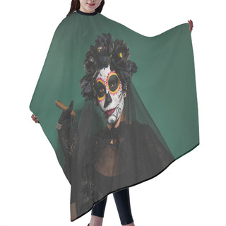 Personality  Woman In Spooky Day Of Death Halloween Costume Looking At Camera And Holding Cigar On Green Background  Hair Cutting Cape