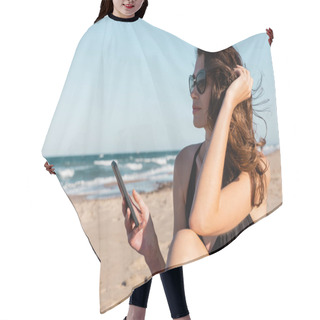 Personality  Young Woman In Swimsuit And Sunglasses Holding Smartphone Near Sea Hair Cutting Cape