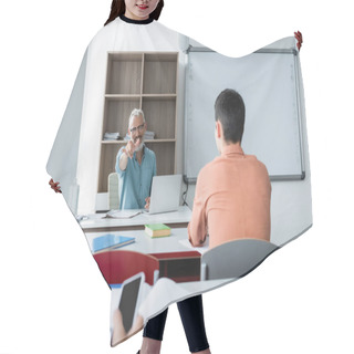 Personality  Smiling Teacher Pointing With Finger Near Schoolboys And Gadgets In Classroom  Hair Cutting Cape