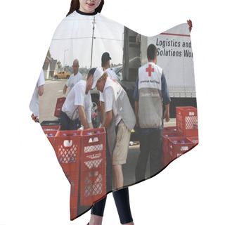 Personality  BILOXI, UNITED STATES - Sep 09, 2005: Navy And Red Cross Personnel Load Cartons Of Bottled Water For Hurricane Katrina Victims. Hair Cutting Cape