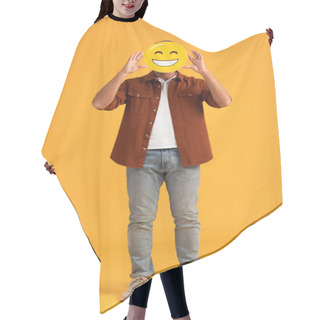 Personality  KYIV, UKRAINE - SEPTEMBER 24, 2019: Man Covering Face With Happy Emoticon On Orange  Hair Cutting Cape