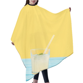 Personality  Fresh Cold Summer Drink In Glass With Drinking Straw On Yellow Hair Cutting Cape