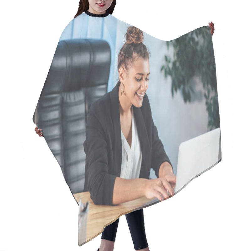 Personality  A Young Girl Dressed In Business Clothes Is Working On A Laptop. Hair Cutting Cape