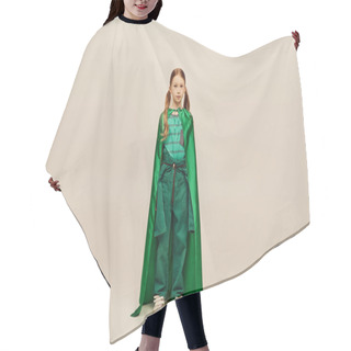 Personality  Redhead Preteen Girl In Green Superhero Costume And Cape Looking At Camera While Standing On Grey Background During Global Child Protection Day Celebration  Hair Cutting Cape