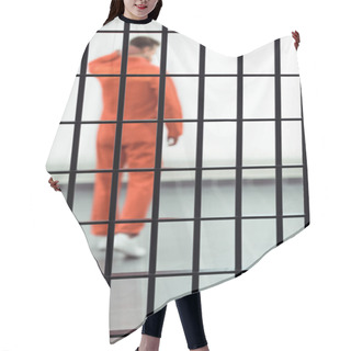 Personality  Rear View Of Prisoner In Prison Cell With Metallic Bars On Foreground  Hair Cutting Cape