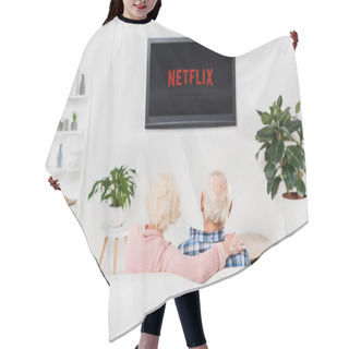 Personality  Back View Of Senior Couple Watching Netflix On Tv At Home Hair Cutting Cape