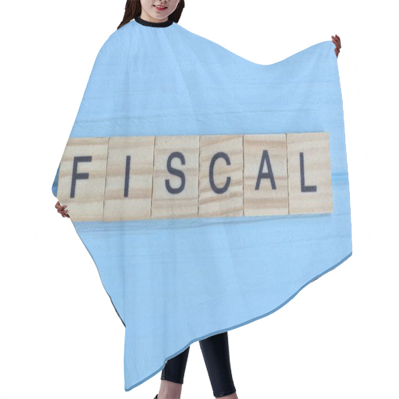 Personality  Word Fiscal Made From Wooden Gray Letters Lies On A Blue Wood Table Hair Cutting Cape