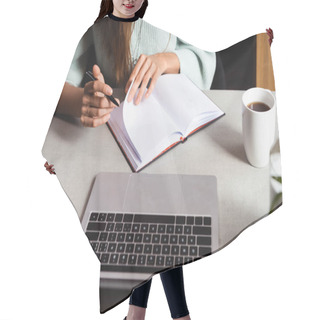 Personality  Cropped View Of Woman Studying Online With Notepad And Laptop In Cafe With Cup Of Coffee   Hair Cutting Cape