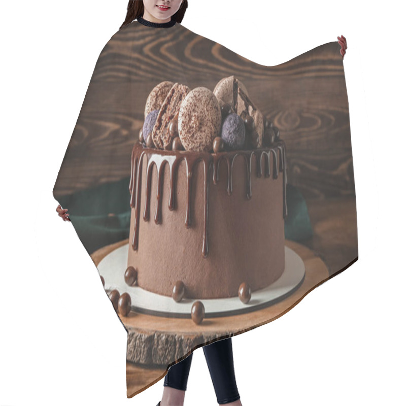 Personality  Sweet chocolate cake on wooden table hair cutting cape