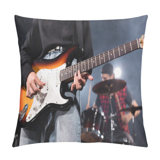 Personality  KYIV, UKRAINE - AUGUST 25, 2020: Female Musician Playing Electric Guitar With Blurred Drummer On Background Pillow Covers