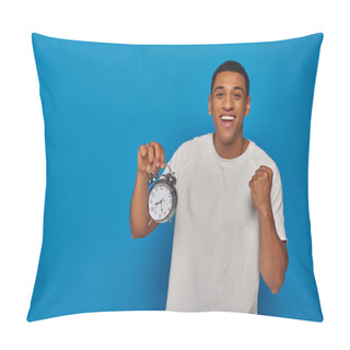 Personality  Excited African American Man With Open Mouth Holding Alarm Clock On Blue Background, Face Expression Pillow Covers