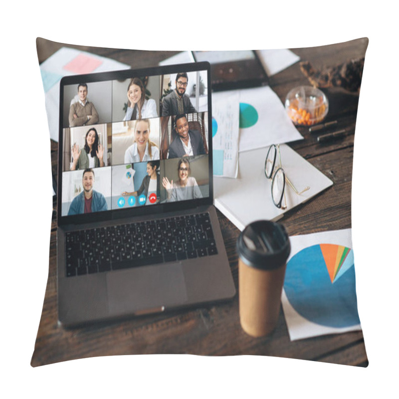 Personality  Virtual business meeting online. Video conference by laptop. Online business meeting. On the laptop screen that standing on a desk, coworkers who gathered in a video conference to work online pillow covers