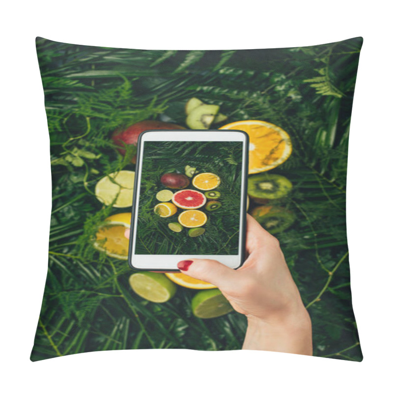 Personality  cropped view of food blogger taking photo of fresh fruits on smartphone pillow covers
