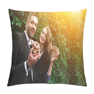Personality  Portrait Of Smiling Fashionable Couple With Chocolate Doughnuts With Green Foliage Behind Pillow Covers