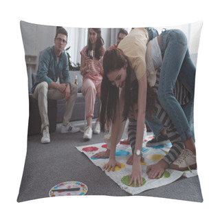 Personality  KYIV, UKRAINE - JANUARY 27, 2020: Cheerful Girls Playing Twister Game While Friends Resting On Sofa Pillow Covers